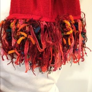 Red scarf with multi-colored fringe